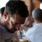 Person smelling glass of beer